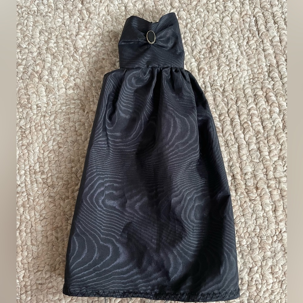Assorted vintage Barbie dresses and shoes